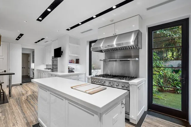 a kitchen that has a stove and a microwave