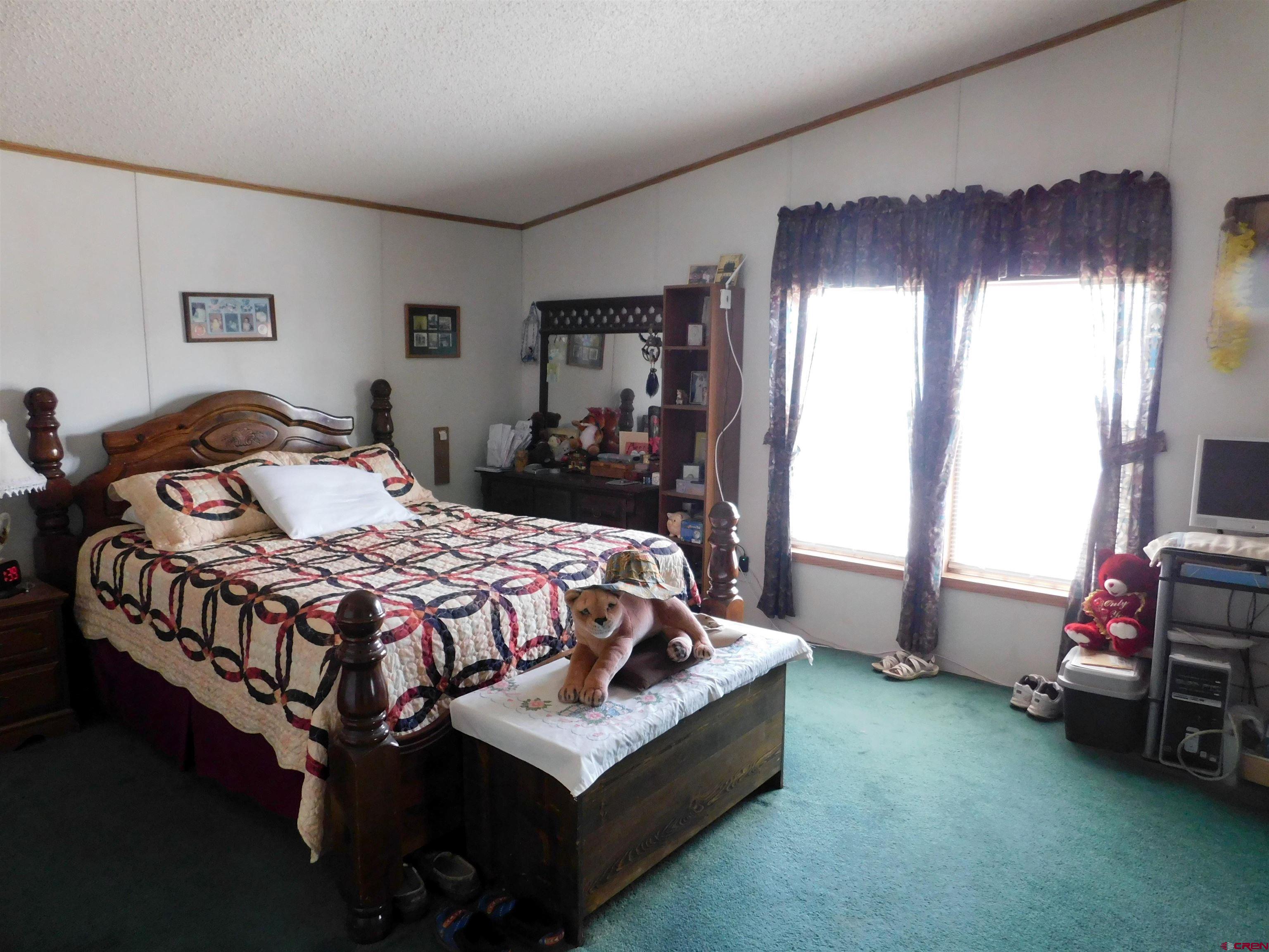 600 County Road 8F Egnar, CO 81325 - Photo 11 of 45 a bedroom with a bed and a window