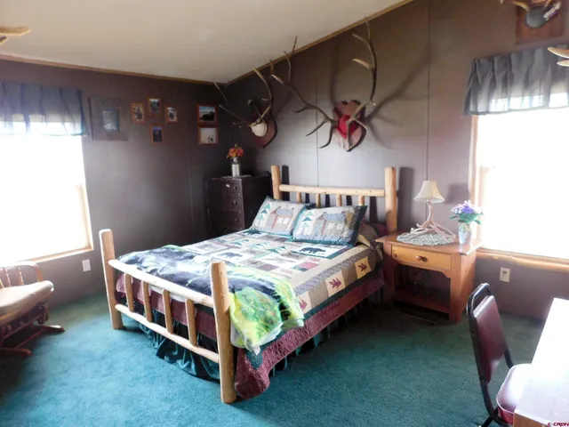 a bedroom with bed and a window