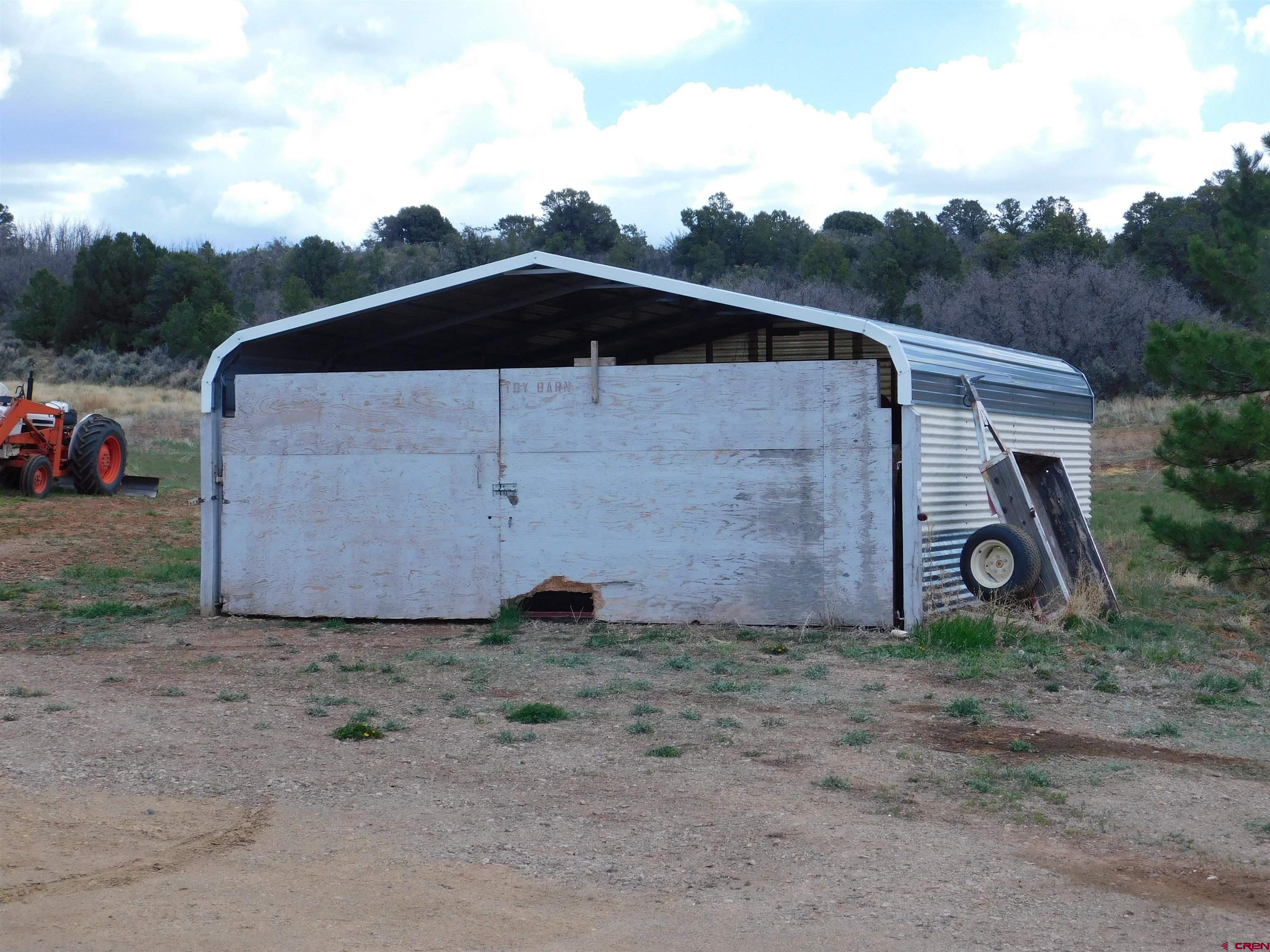 600 County Road 8F Egnar, CO 81325 - Photo 28 of 45 a view of a small house in middle of the green field