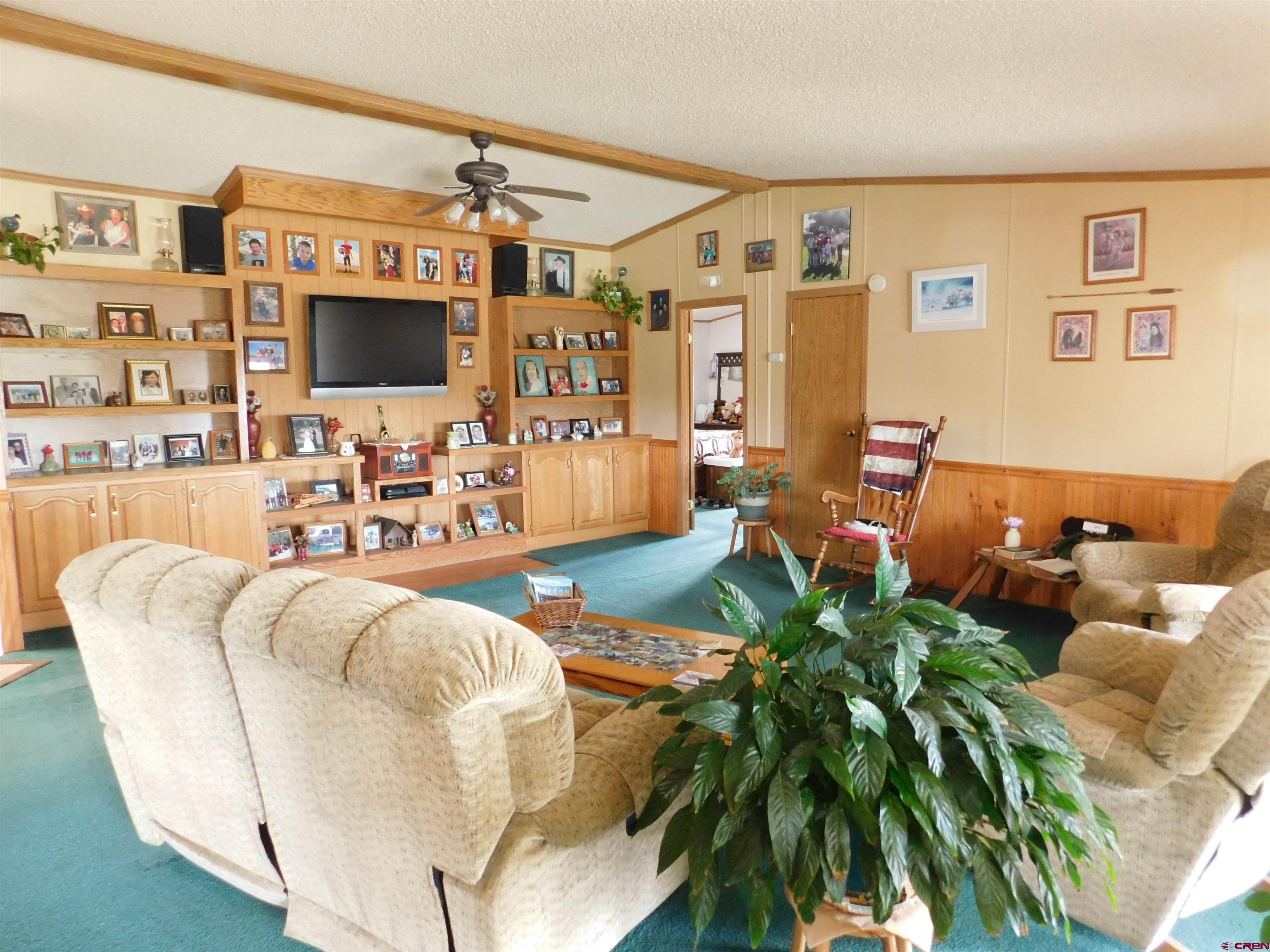 600 County Road 8F Egnar, CO 81325 - Photo 4 of 45 a living room with patio furniture and a flat screen tv