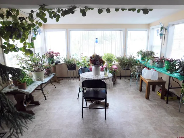 a large kitchen with a table and chairs