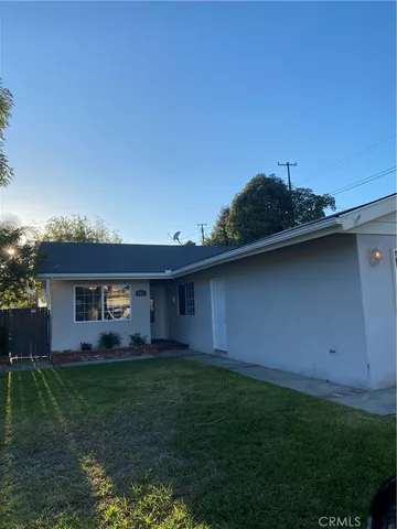 a backyard of a house with a garden and deck