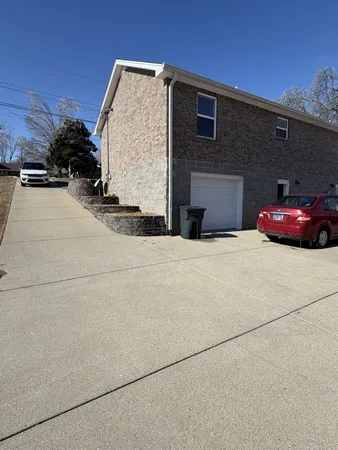 a view of a house with a snow on the road