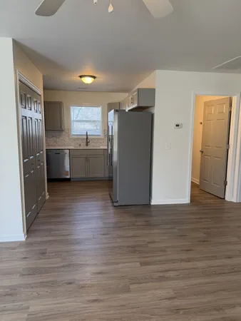 a view of kitchen with furniture and wooden floor