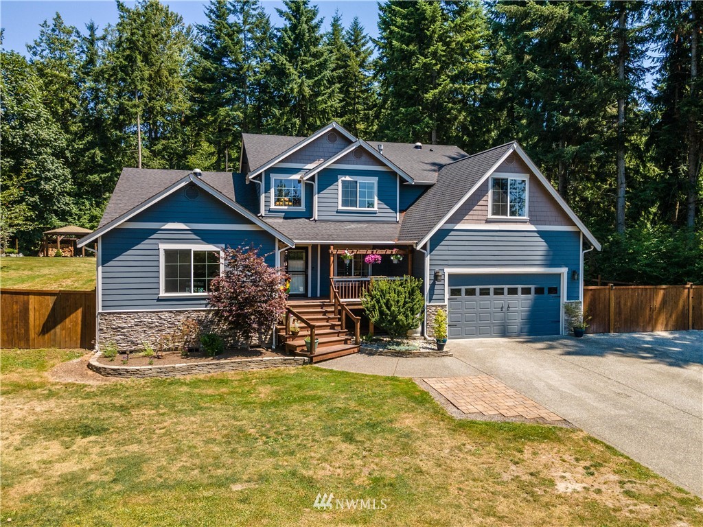 a front view of house with yard outdoor seating and barbeque oven