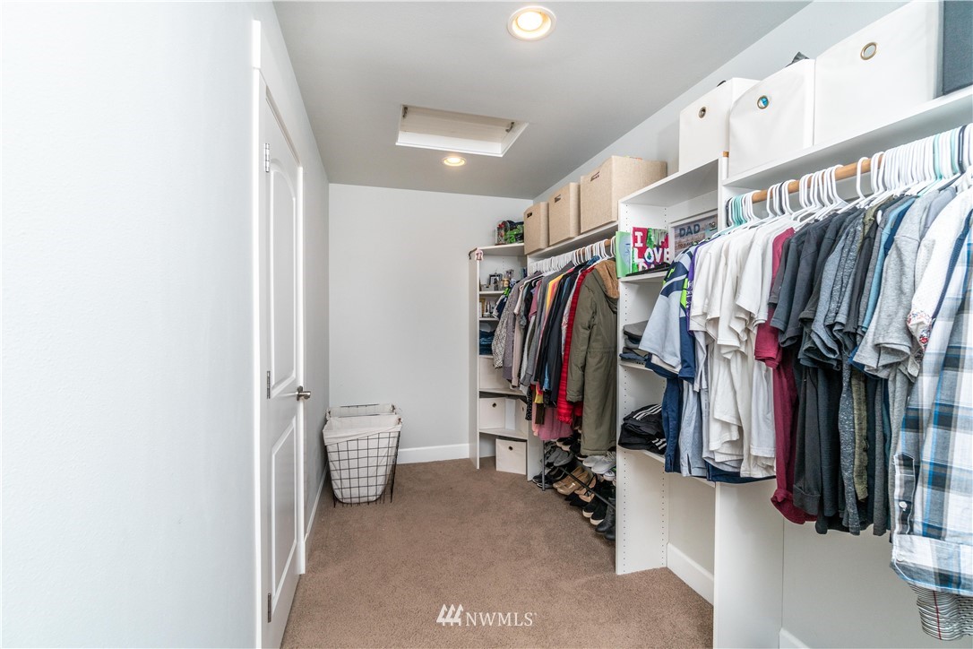 27515 Rose Road Arlington, WA 98223 - Photo 11 of 31 a view of walk in closet with clothes and shoes