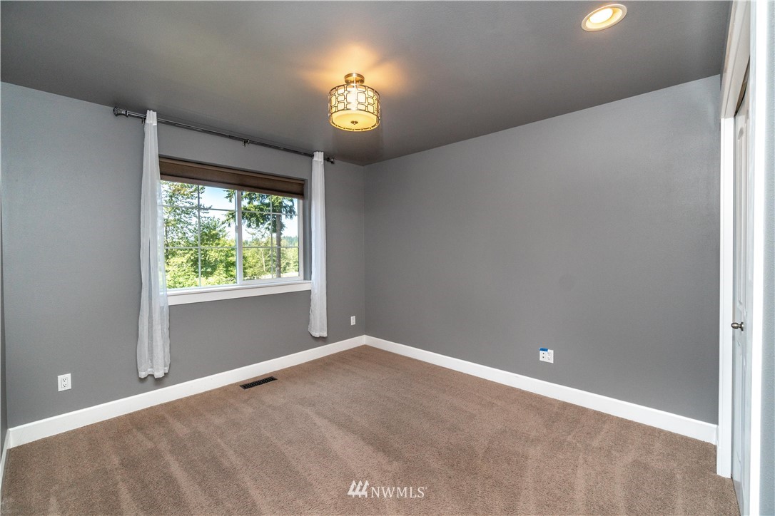 27515 Rose Road Arlington, WA 98223 - Photo 13 of 31 a view of an empty room with a window