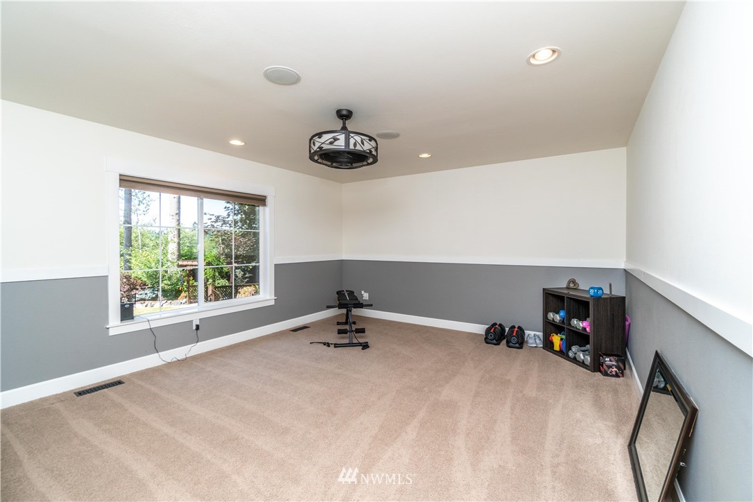 27515 Rose Road Arlington, WA 98223 - Photo 14 of 31 a room with a window and a table
