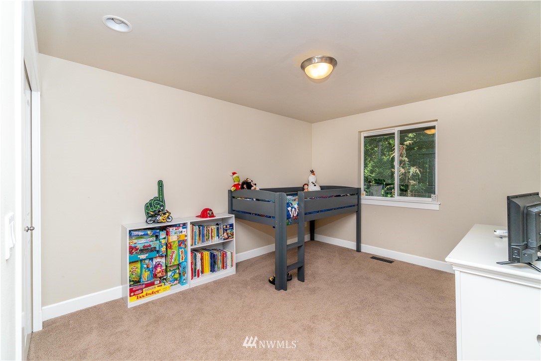 27515 Rose Road Arlington, WA 98223 - Photo 18 of 31 a view of a workspace with furniture and a window