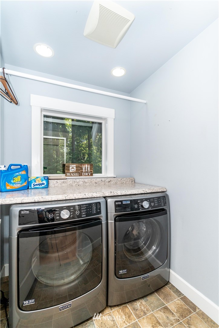 27515 Rose Road Arlington, WA 98223 - Photo 20 of 31 a stove top oven sitting inside of a kitchen