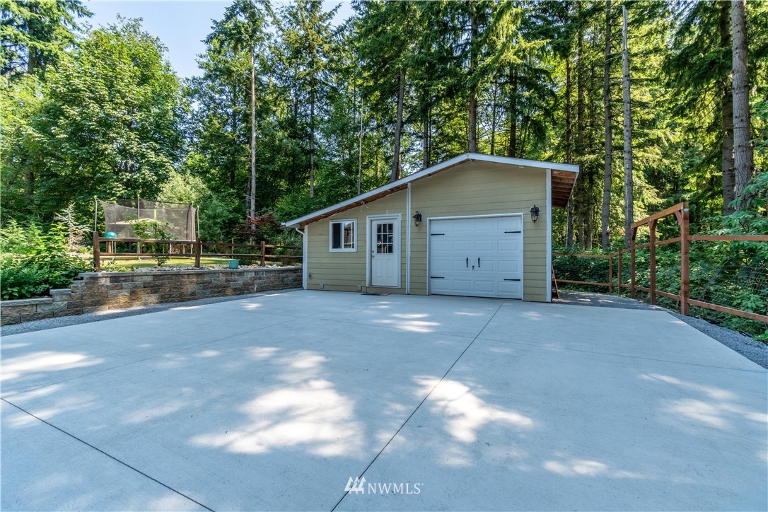 27515 Rose Road Arlington, WA 98223 - Photo 24 of 31 a view of a house with a outdoor space