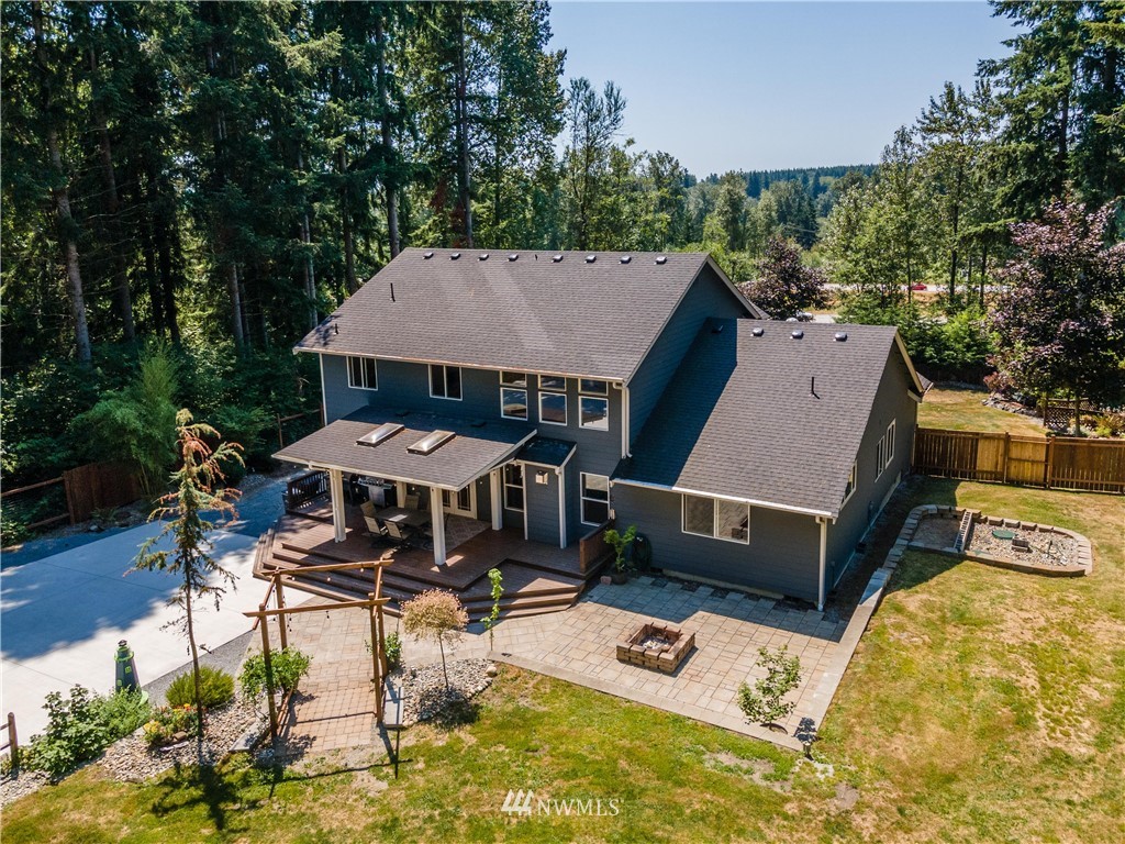 27515 Rose Road Arlington, WA 98223 - Photo 26 of 31 a view of a patio with furniture and a yard