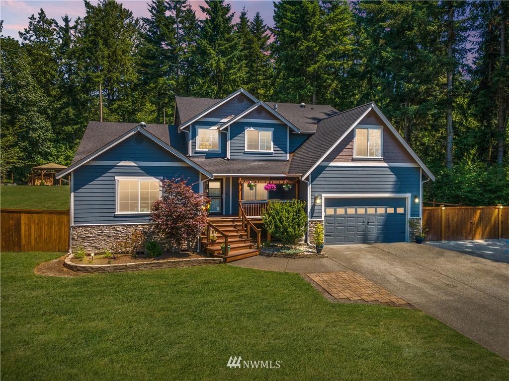 27515 Rose Road Arlington, WA 98223 - Photo 30 of 31 a front view of a house with a yard and outdoor seating