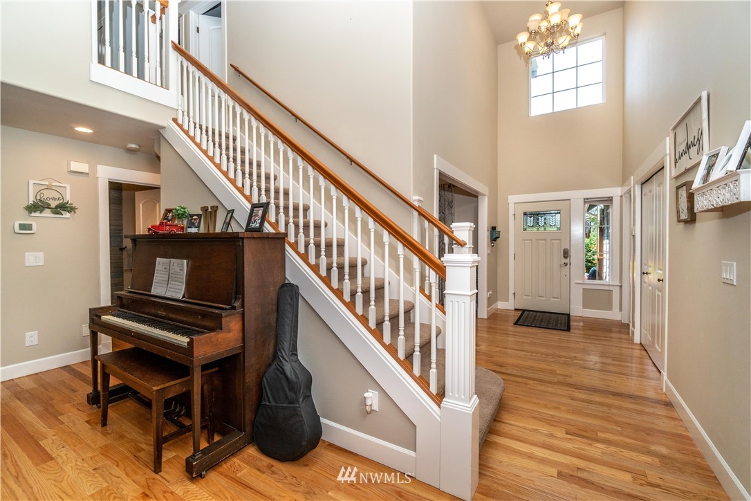 27515 Rose Road Arlington, WA 98223 - Photo 4 of 31 a view of entryway and hall with wooden floor