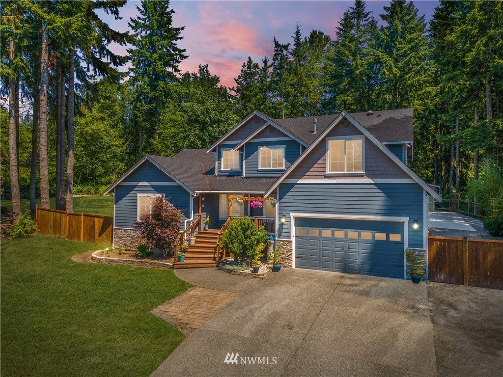 27515 Rose Road Arlington, WA 98223 - Photo 31 of 31 a front view of a house with a yard and garage