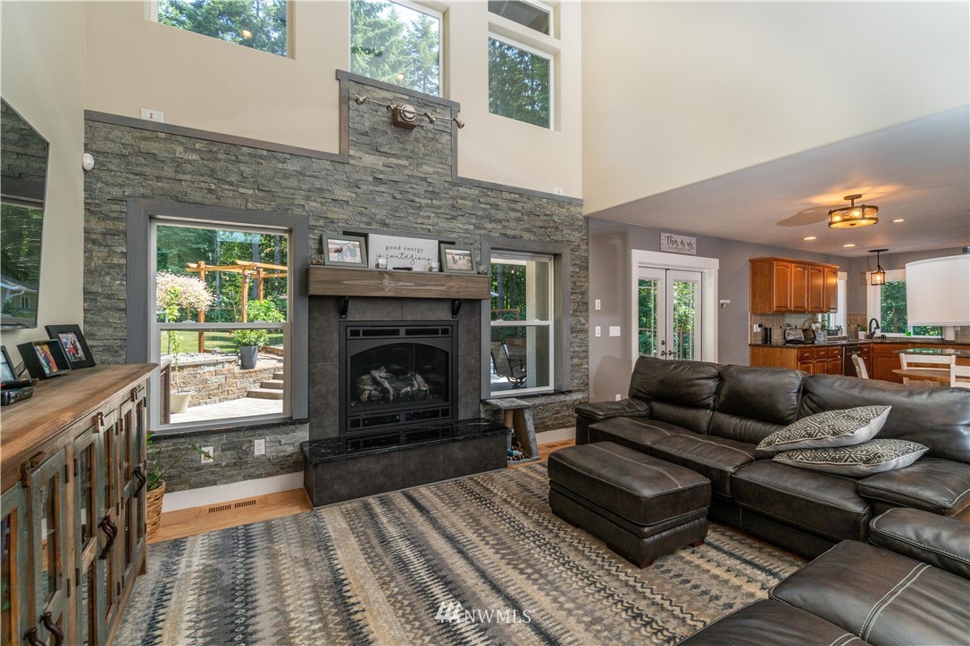 27515 Rose Road Arlington, WA 98223 - Photo 5 of 31 a living room with furniture and a fireplace
