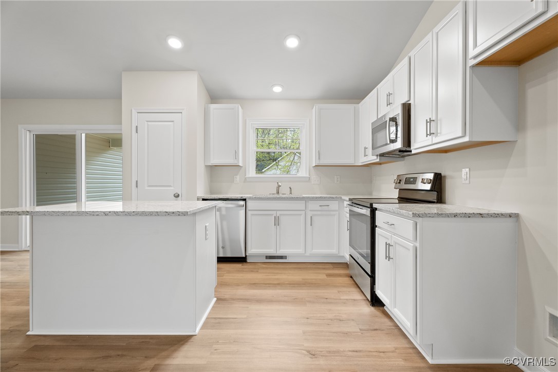 4865 Three Chopt Road Louisa, VA 23093 - Photo 5 of 14 a kitchen with granite countertop white cabinets and white appliances