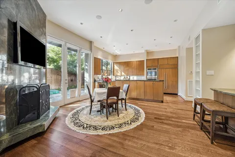 a backyard of a house with table and chairs