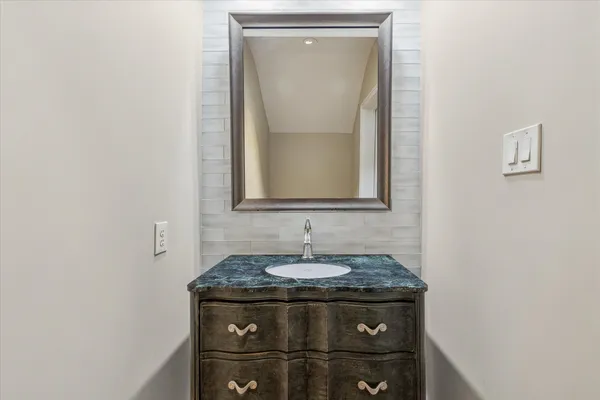 a white bath tub sitting in a bathroom and shower