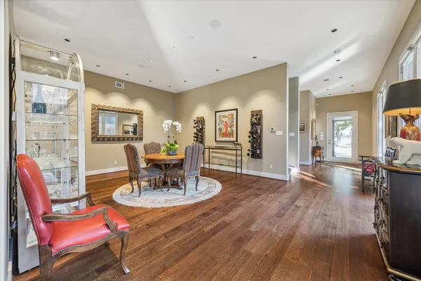 a view of a dining room with furniture window and wooden floor