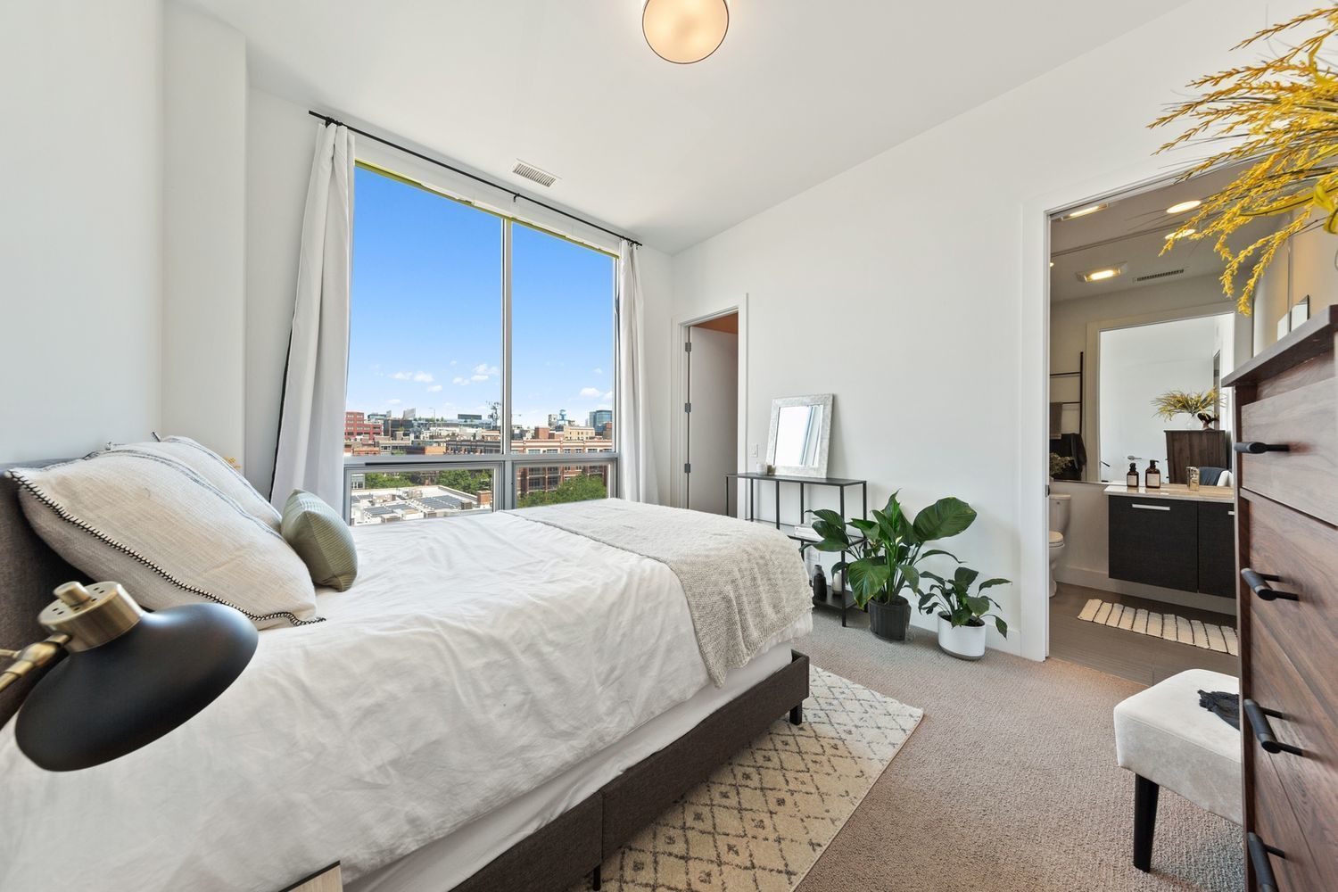 122 South Aberdeen Street, Unit 5N Chicago, IL 60607 - Photo 18 of 23 a bedroom with a bed potted plant and a window