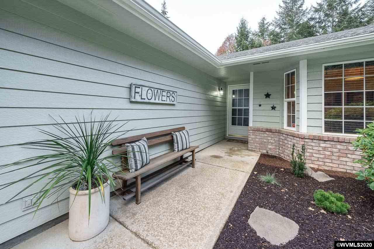 15241 Strong Road Dallas, OR 97338 - Photo 5 of 40 a potted plant sitting in front of a house