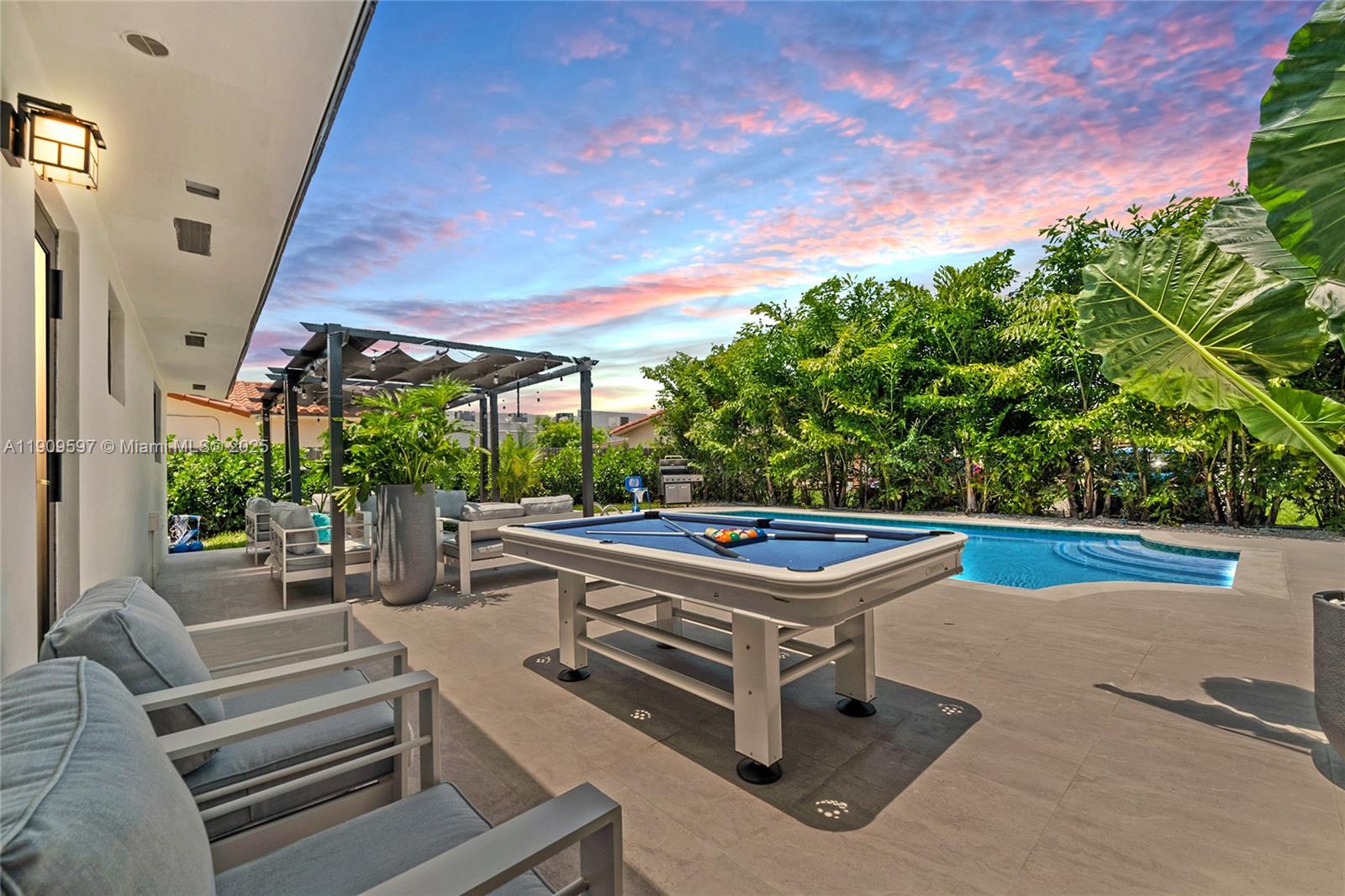 2585 Southwest 108th Avenue Miami, FL 33165 - Photo 1 of 11 a outdoor living space with furniture and garden view