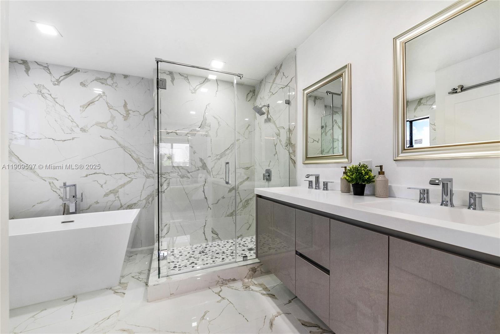 2585 Southwest 108th Avenue Miami, FL 33165 - Photo 4 of 11 a bathroom with a double vanity sink toilet and shower