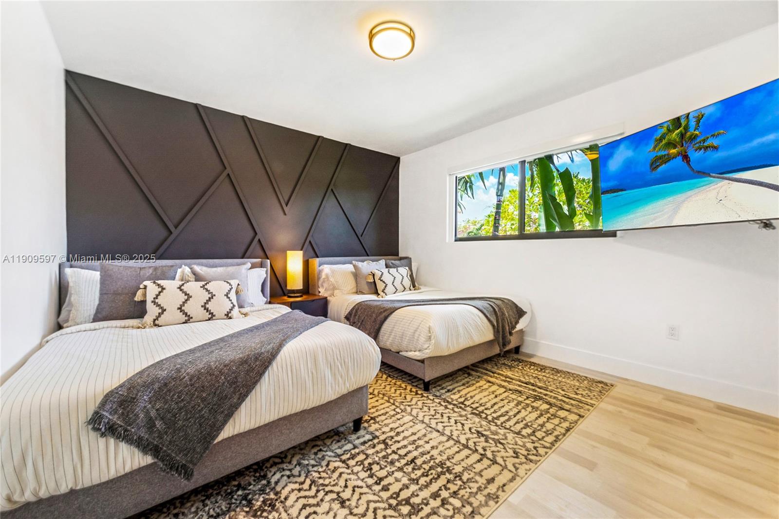 2585 Southwest 108th Avenue Miami, FL 33165 - Photo 6 of 11 a bedroom with two beds and painting on the wall