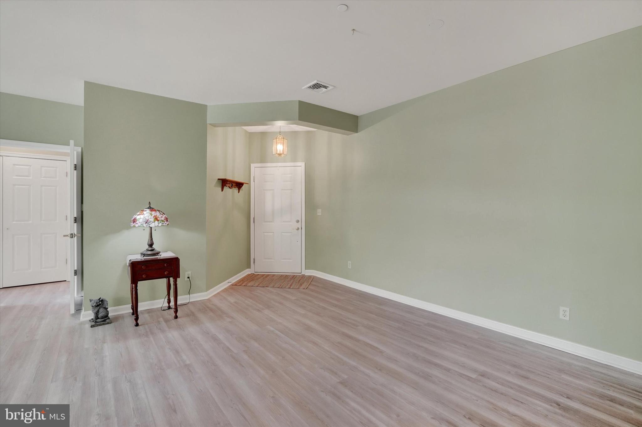 1010 Crest Way, Unit 304 York, PA 17403 - Photo 13 of 24 a hallway with wooden floor