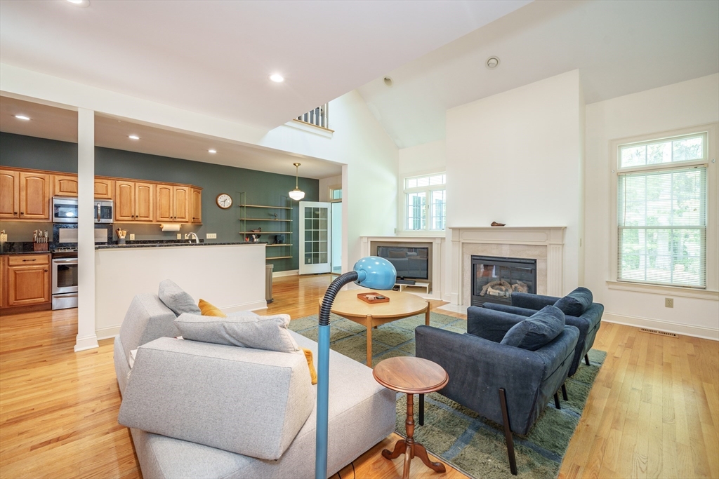 97 High Pine Circle, Unit 97 Wilbraham, MA 01095 - Photo 14 of 37 a living room with furniture and a fireplace