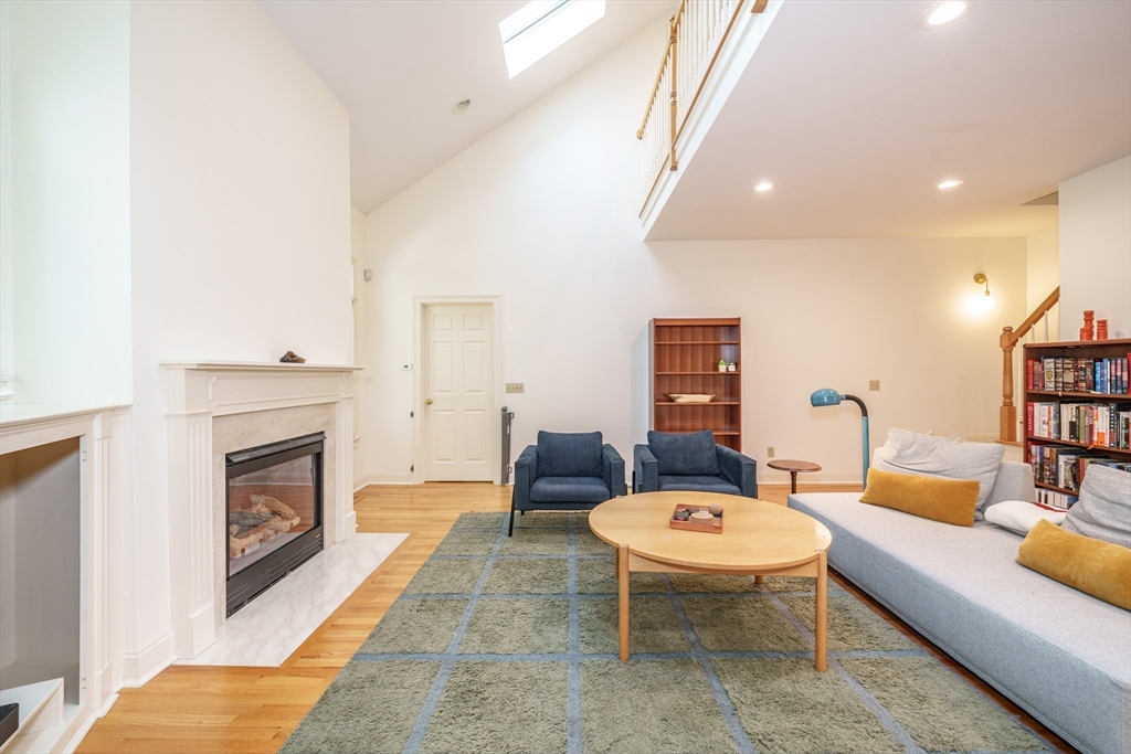 97 High Pine Circle, Unit 97 Wilbraham, MA 01095 - Photo 16 of 37 a living room with furniture and a fireplace