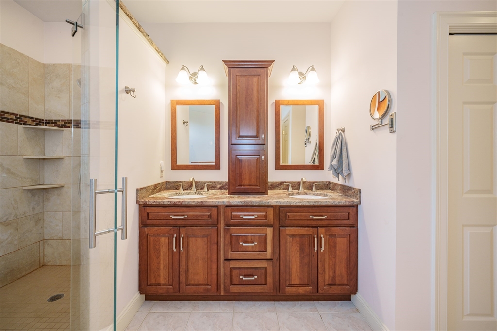 97 High Pine Circle, Unit 97 Wilbraham, MA 01095 - Photo 21 of 37 a bathroom with a granite countertop sink a mirror and a shower