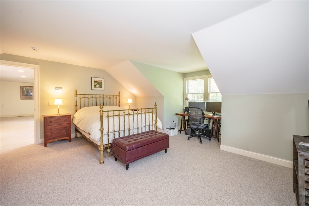 97 High Pine Circle, Unit 97 Wilbraham, MA 01095 - Photo 27 of 37 a living room with furniture and a flat screen tv