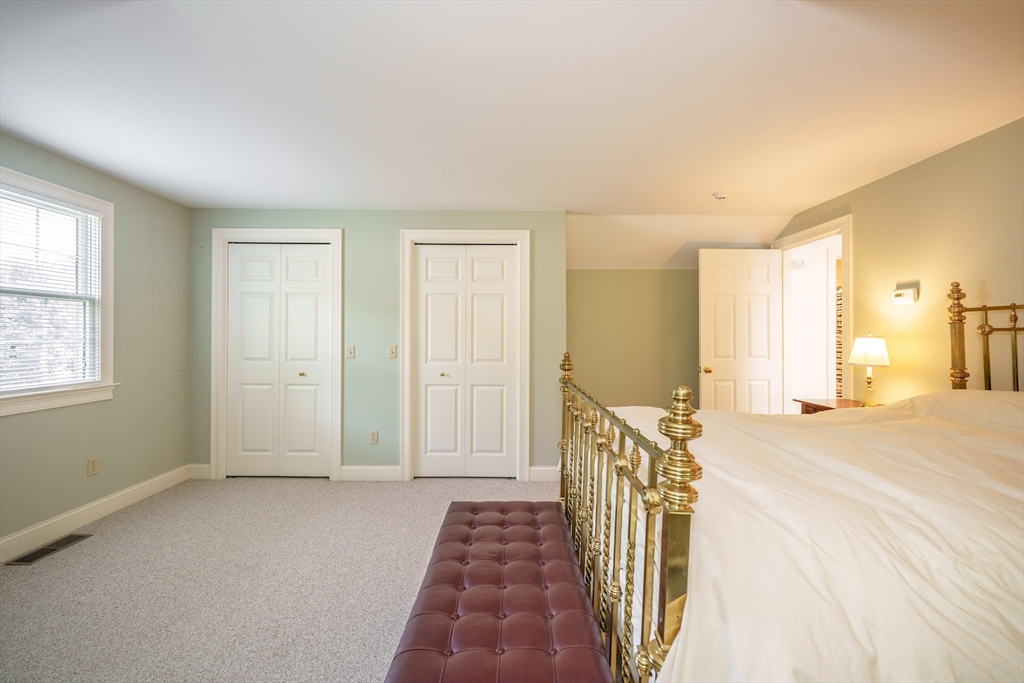 97 High Pine Circle, Unit 97 Wilbraham, MA 01095 - Photo 29 of 37 a bedroom with a bed and a window