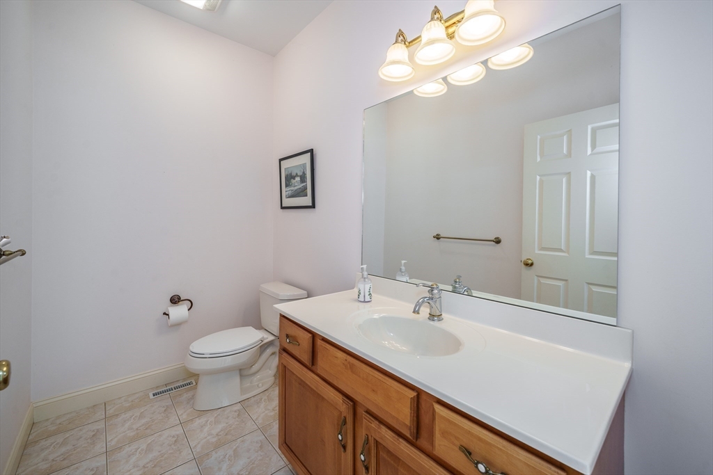 97 High Pine Circle, Unit 97 Wilbraham, MA 01095 - Photo 5 of 37 a bathroom with a toilet sink and mirror
