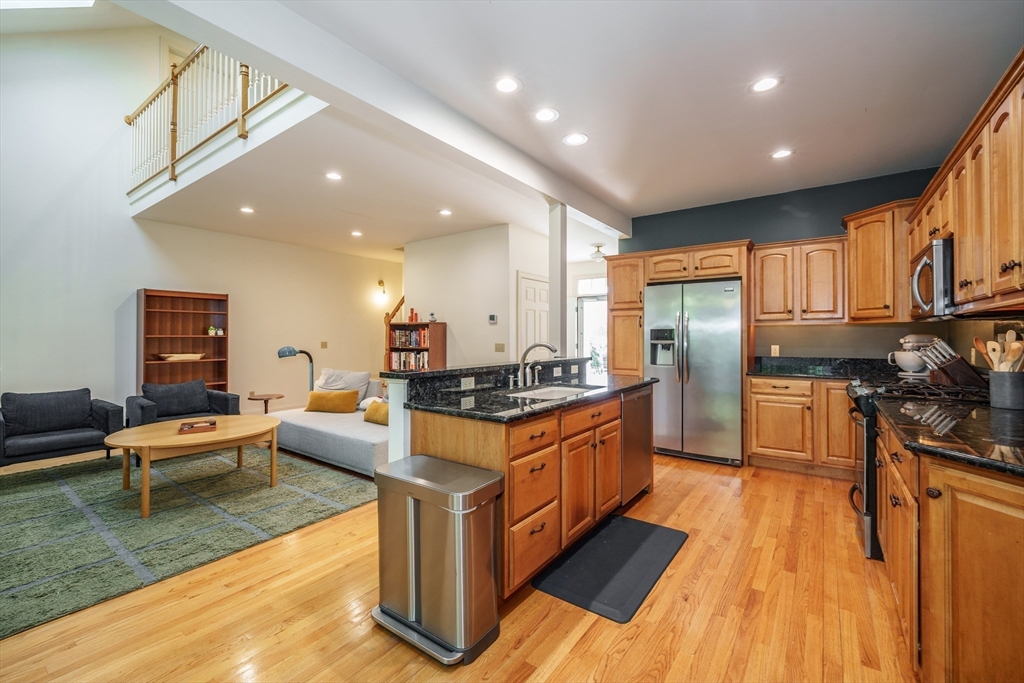 97 High Pine Circle, Unit 97 Wilbraham, MA 01095 - Photo 9 of 37 a kitchen with stainless steel appliances granite countertop a stove refrigerator and a refrigerator
