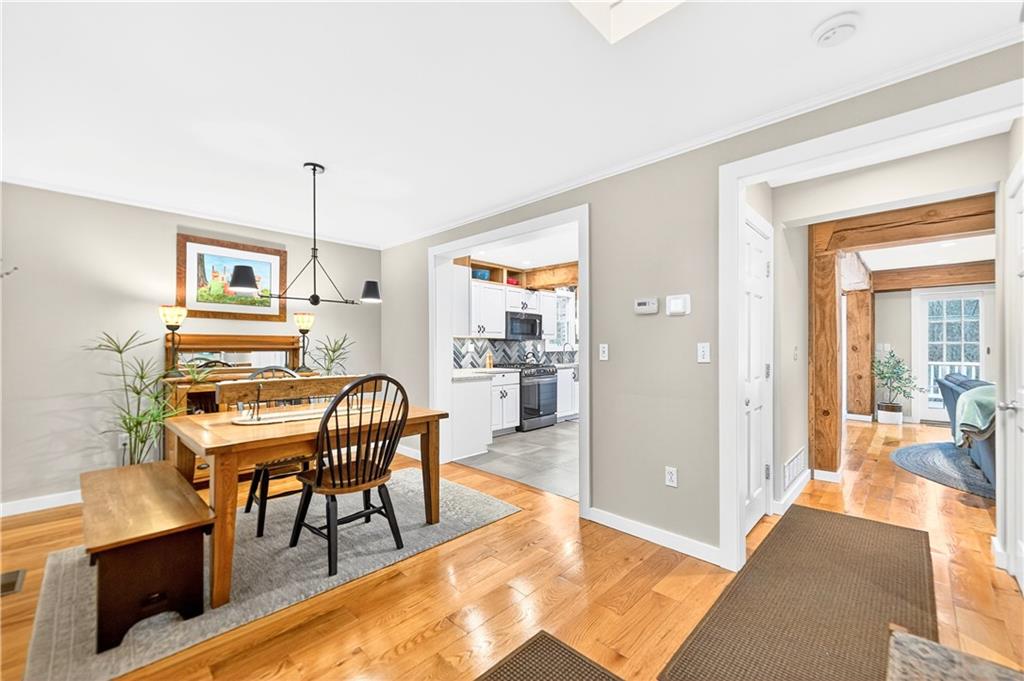 687 Old Millcreek Road Hookstown, PA 15050 - Photo 11 of 50 a dining room with furniture and wooden floor