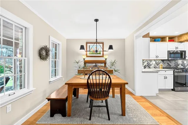 a view of a dining room with furniture window and outside view