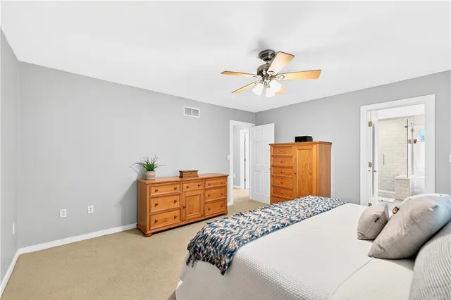 a bedroom with a bed and dresser