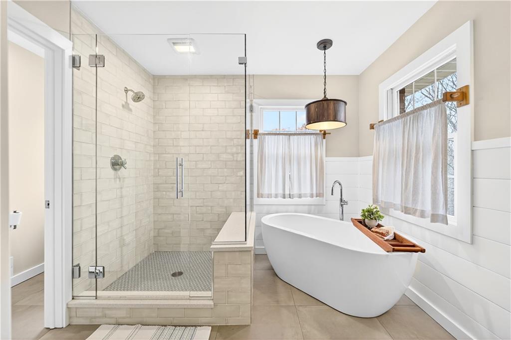 687 Old Millcreek Road Hookstown, PA 15050 - Photo 20 of 50 a bathroom with a tub a sink and shower