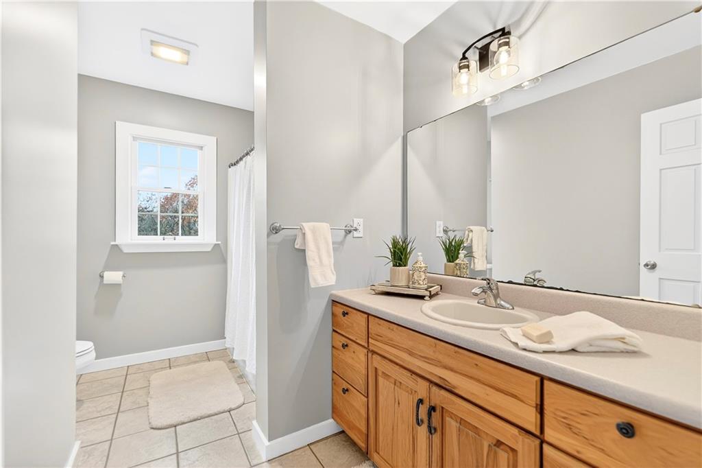 687 Old Millcreek Road Hookstown, PA 15050 - Photo 23 of 50 a bathroom with a granite countertop sink and a mirror