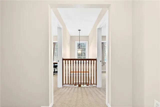 a view of a hallway with a window