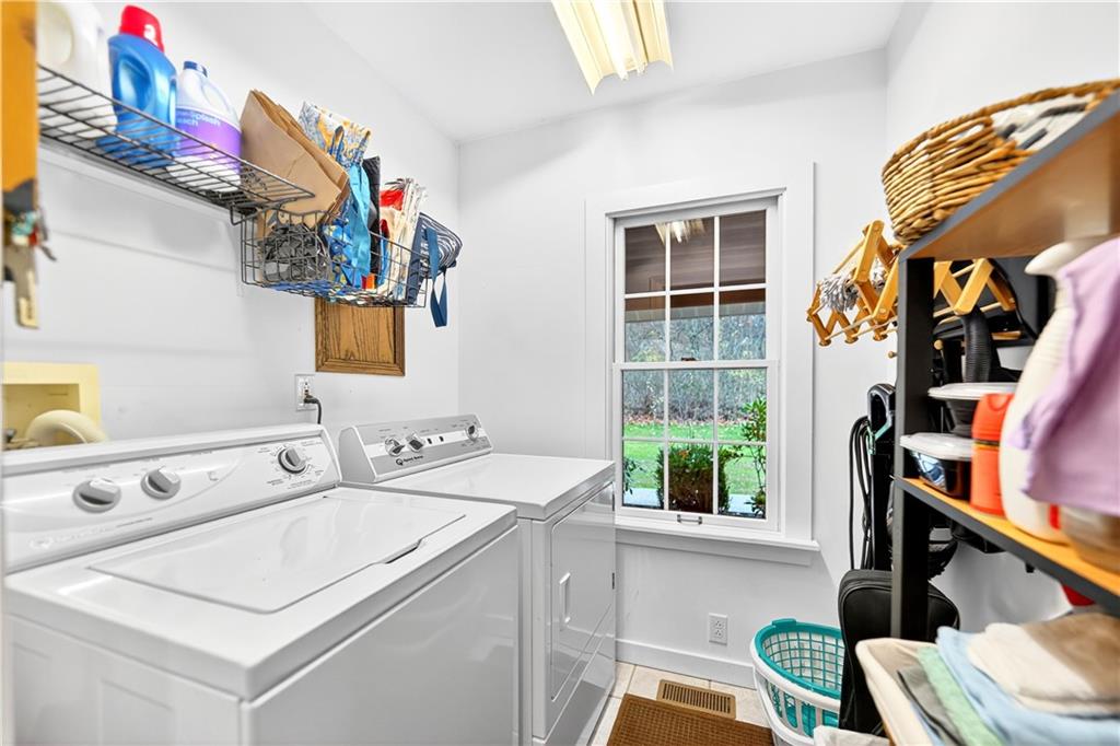 687 Old Millcreek Road Hookstown, PA 15050 - Photo 35 of 50 a utility room with dryer washer and a window