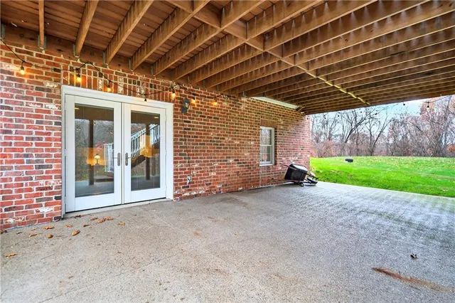 a view of a room with wooden walls