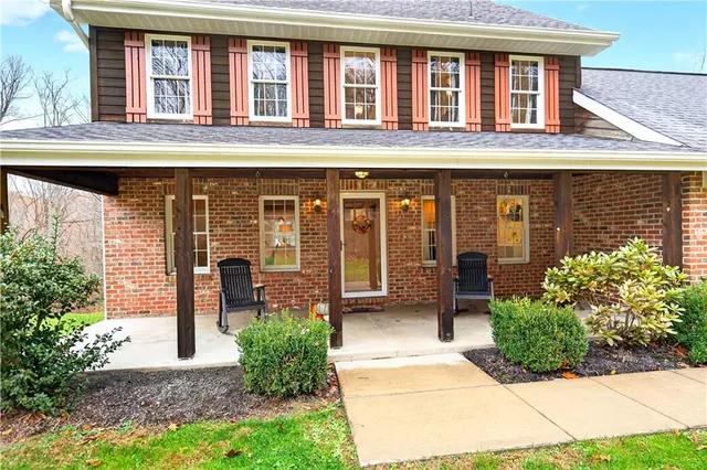 a front view of a building with garden