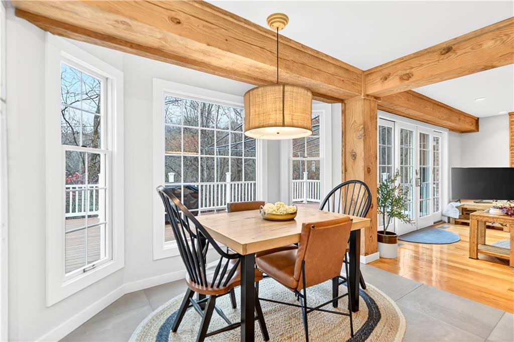 687 Old Millcreek Road Hookstown, PA 15050 - Photo 10 of 50 a view of a dining room with furniture wooden floor and chandelier