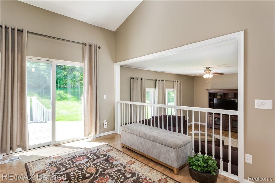 26 Eagle Ridge Road Lake Orion, MI 48360 - Photo 8 of 23 The large door wall allows for plenty of natural light.