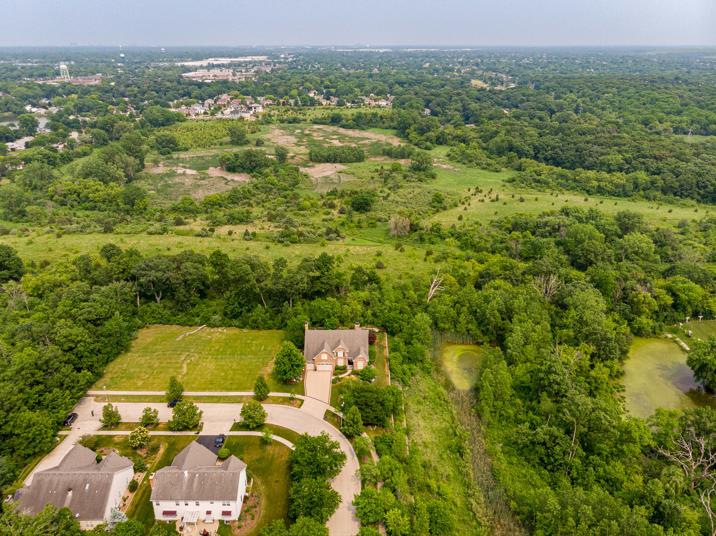 551 Reading Drive Bartlett, IL 60103 - Photo 2 of 2 an aerial view of residential houses with outdoor space and trees